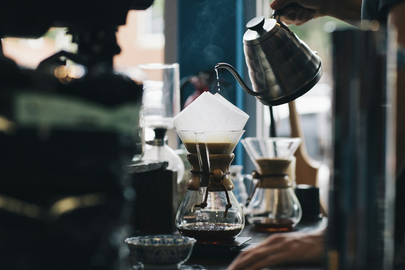 Freshly roasted coffee beans and a warm cup of coffee