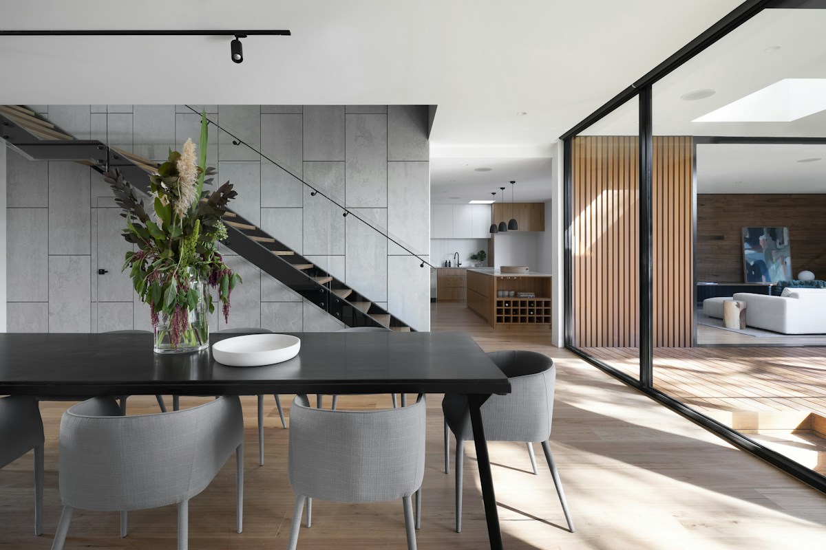 Quiet living room with sculptural furniture and generous windows